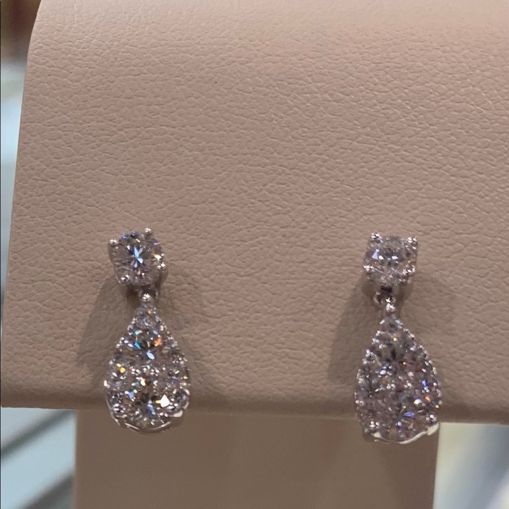 Brand new white diamond earrings .